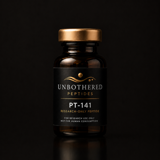 Unbothered Peptides PT-141 10mg research peptide in an amber glass vial with a matte black label and gold cap on a black studio background. Research use only.
