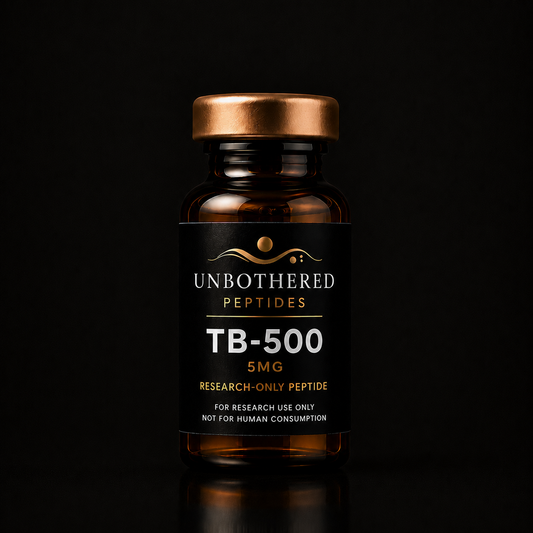 Unbothered Peptides TB-500 10mg research peptide in an amber glass vial with a matte black label, gold cap, and black luxury studio background.